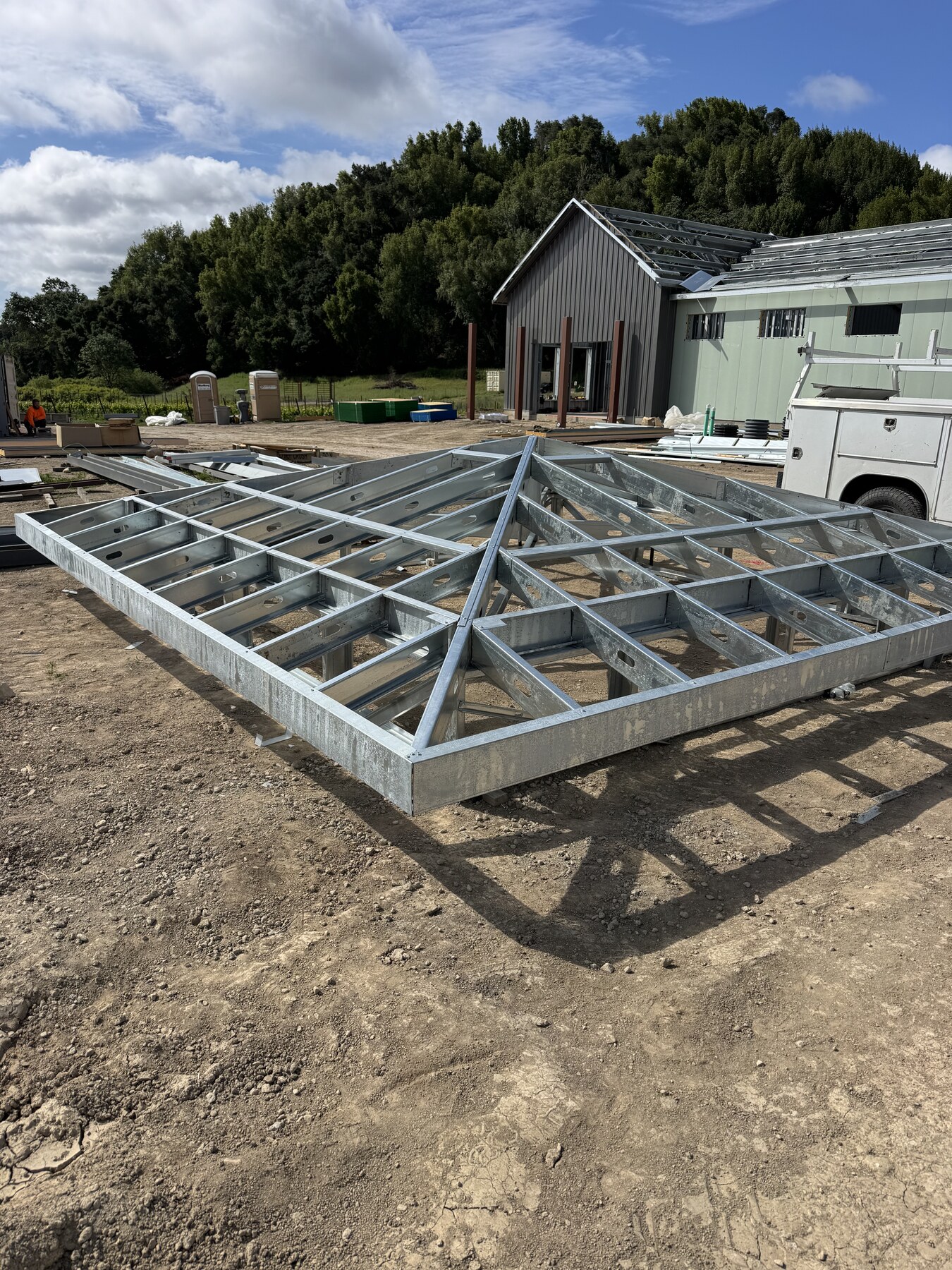 Steel truss roof framing at the Creekcut Winery jobsite by Bradley Commercial Interiors