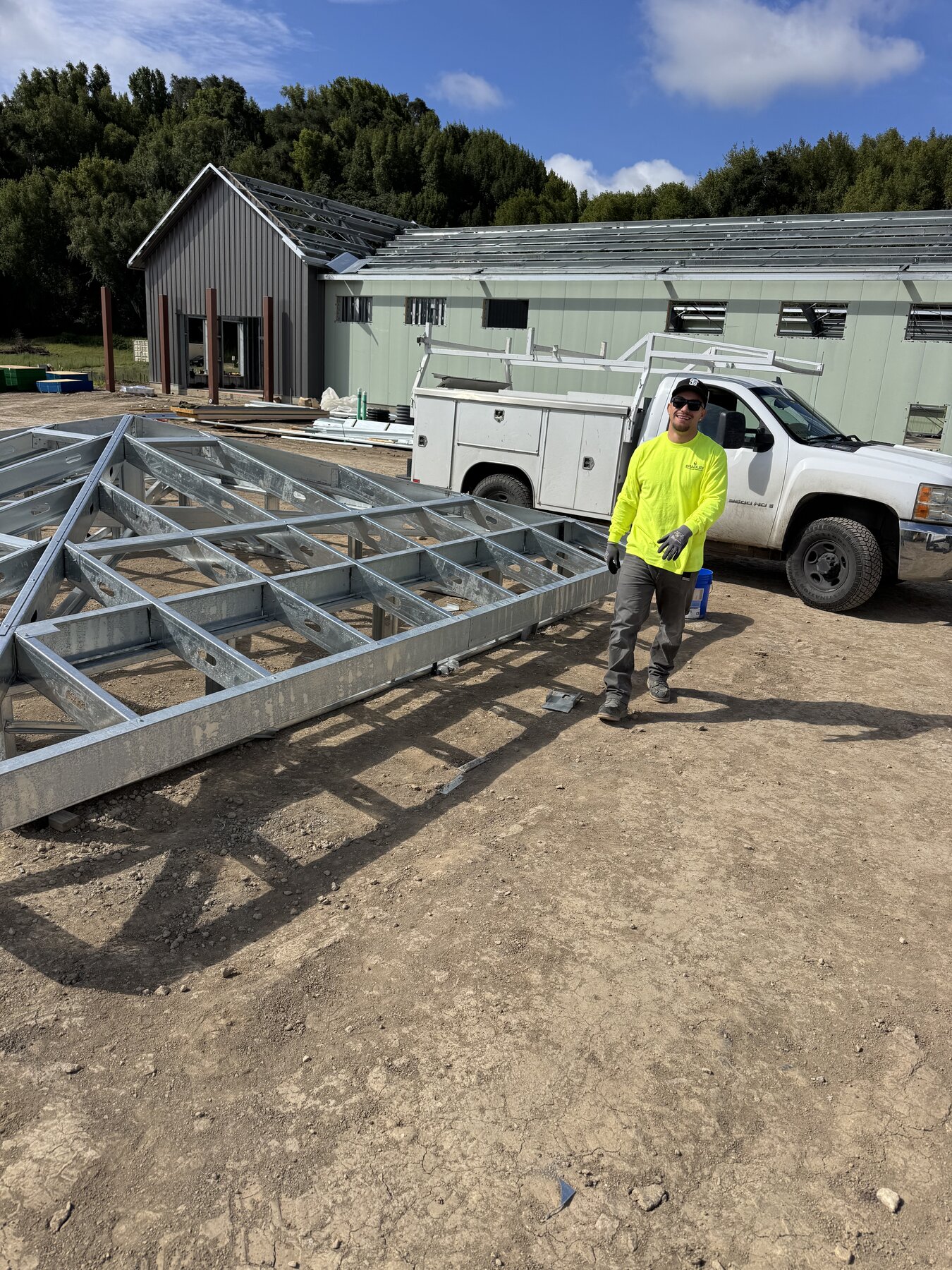 Bradley Commercial Interiors crew member with structural steel roof trusses