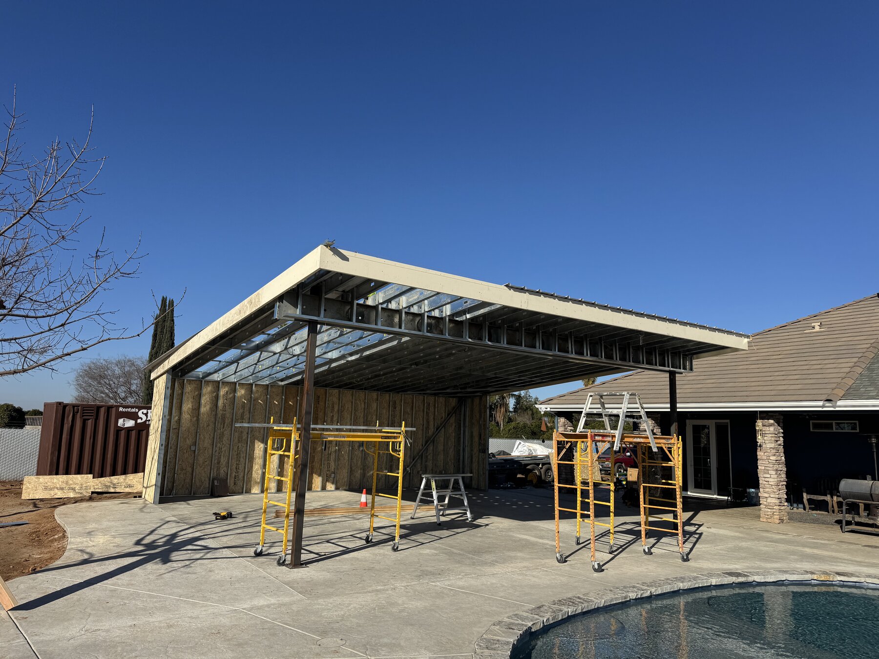 Steel-framed patio cover build by Bradley Commercial Interiors