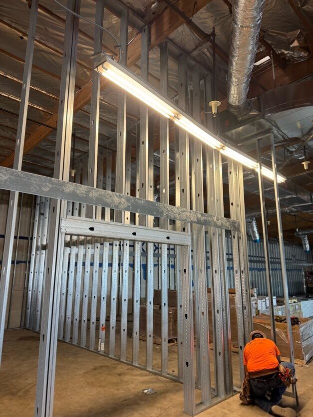 Metal stud framing and door opening at the Ross jobsite by Bradley Commercial Interiors